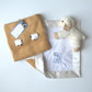 Coffee Milk gift set with the lovey reversed to see the white organic cotton flannel back