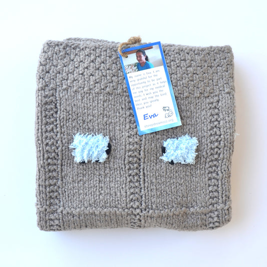 Gray organic blanket with fluffy blue sheep