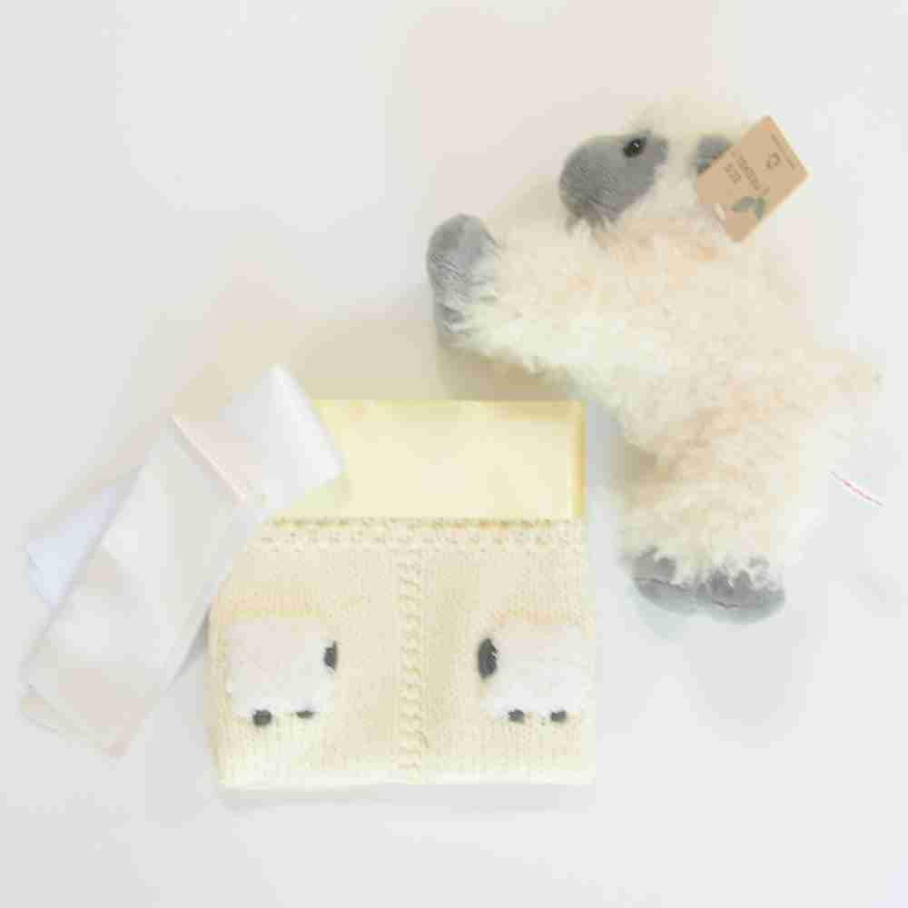 Pale yellow lovey with a fluffy sheep doll.