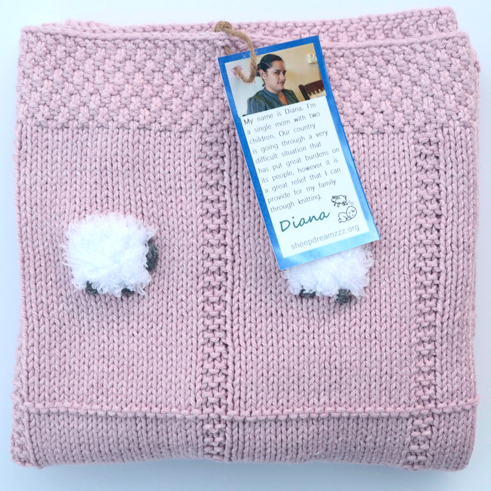 Rose quartz pink baby blanket, folded. Lightweight, all-pima cotton.