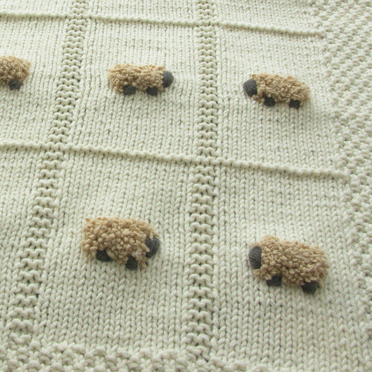 Close-up of vanilla blanket with tan sheep