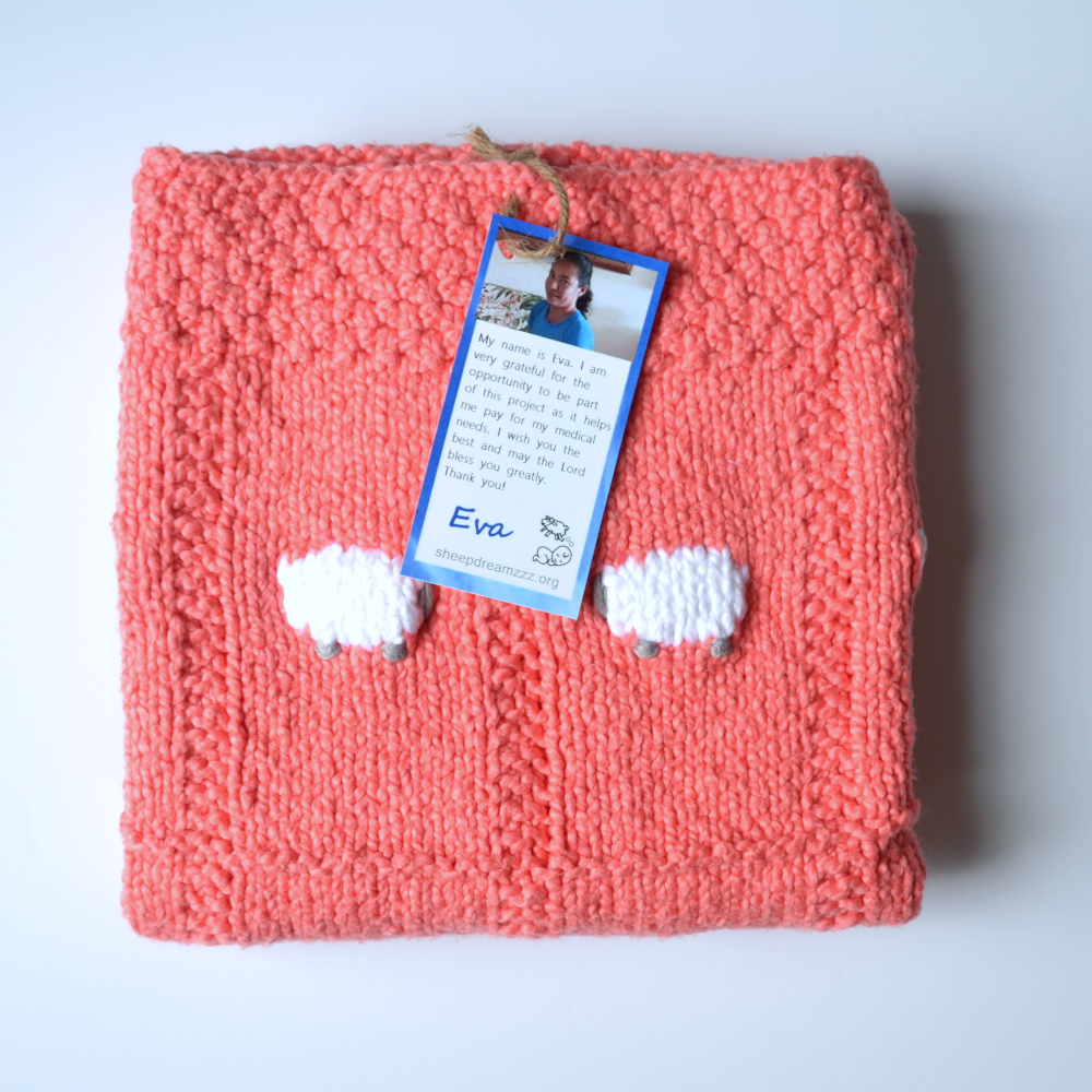 Totally organic baby blanket in a coral color