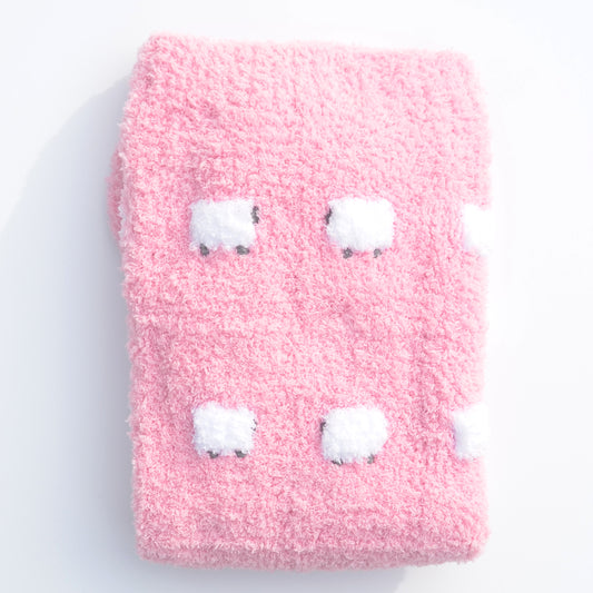 Fluffy sherpa-style pink blanket