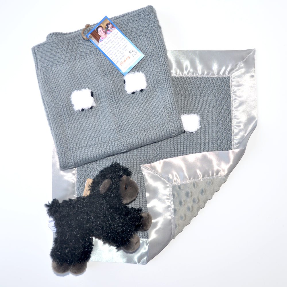 Handmade baby blanket gift set in gray with a fluffy sheep doll.