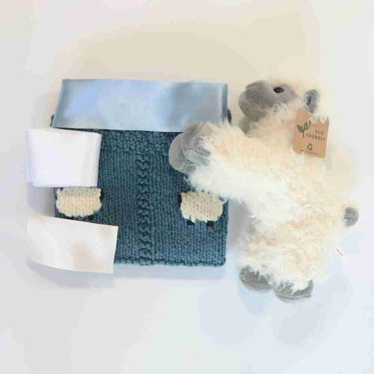 Organic blue lovey with 4 sheep knitted in.