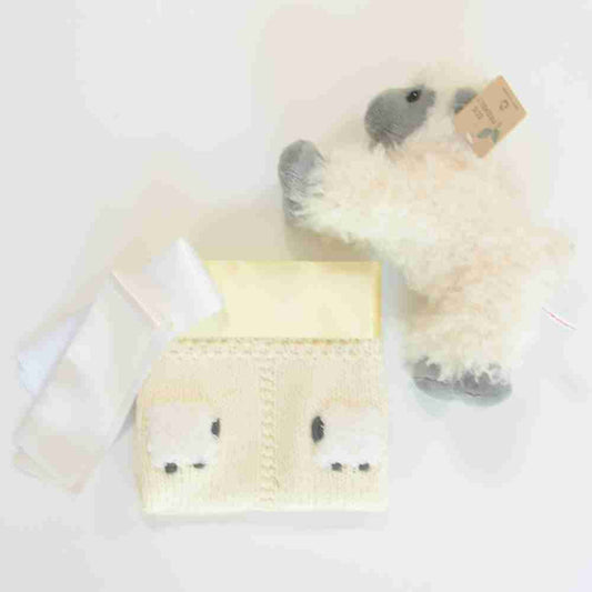 Pale yellow lovey with a fluffy sheep doll.