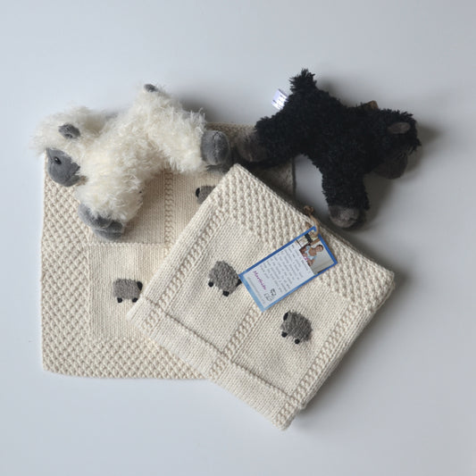 Organic cotton baby gift set, with a blanket, lovey, and sheep doll.