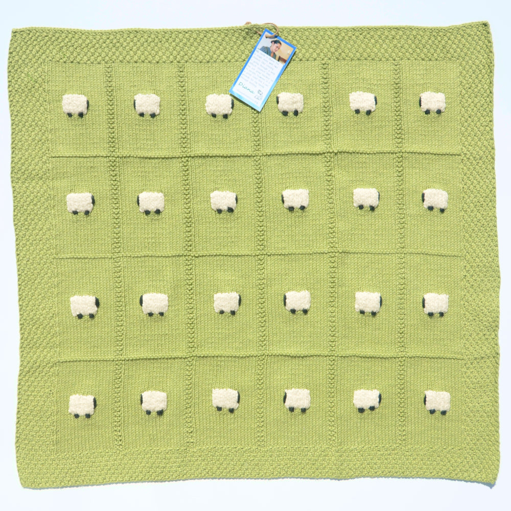 Tea green baby blanket, square, with 24 sheep. All made from cotton.