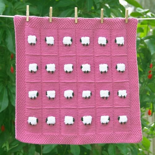 Rose pink soft baby blanket with 24 fluffy white sheep