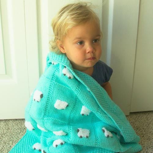 Aqua (blue-green) soft baby blanket with 24 fluffy white sheep