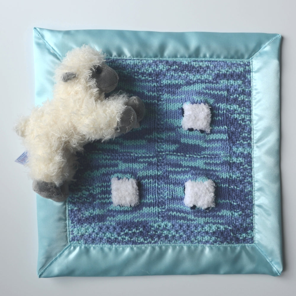 Blue and aqua baby lovey with satin trim and a fluffy sheep doll