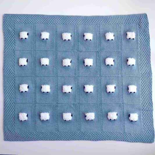 Elegant cotton-based baby blanket in moonstone blue with 24 fluffy white sheep