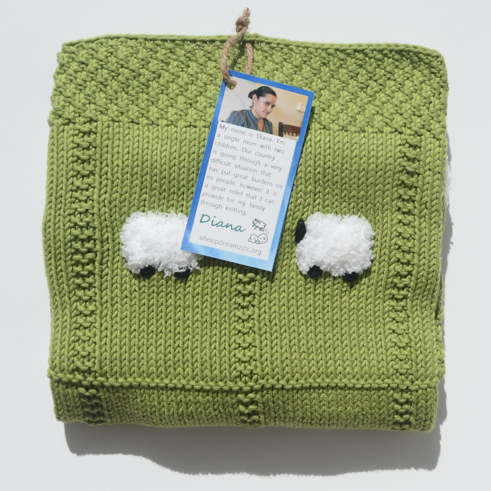 Elms green hand-knitted baby blanket with 24 fluffy sheep.